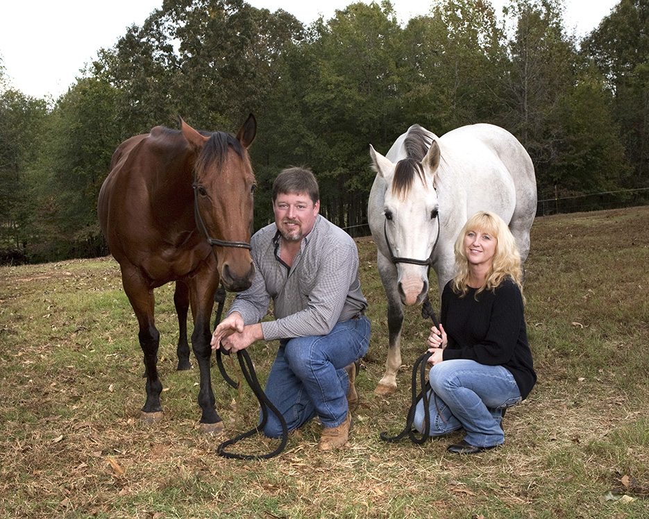 engagement photography, columbus ga engagement photographer, man and woman kneeling by horses